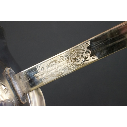 140 - A British military officers dress sword, etched blade with the QEII cypher, complete with scabbard.