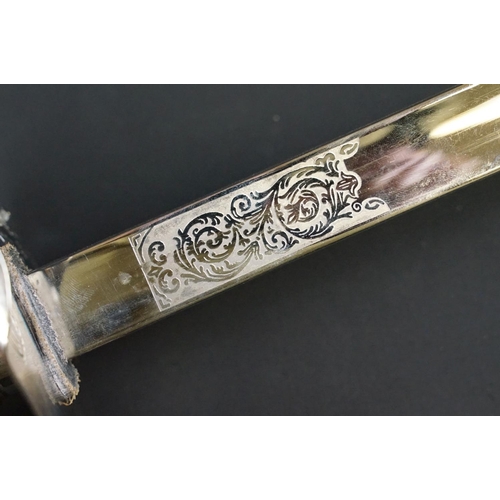 140 - A British military officers dress sword, etched blade with the QEII cypher, complete with scabbard.