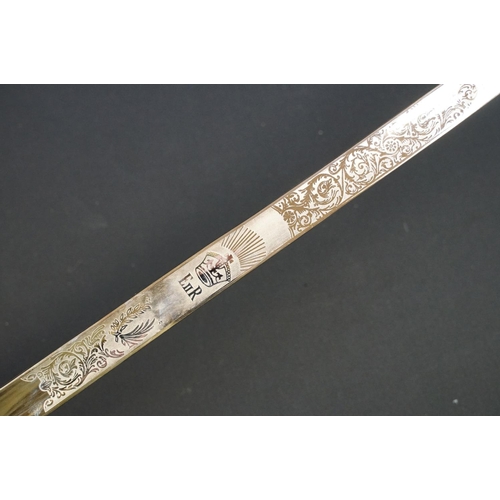 140 - A British military officers dress sword, etched blade with the QEII cypher, complete with scabbard.