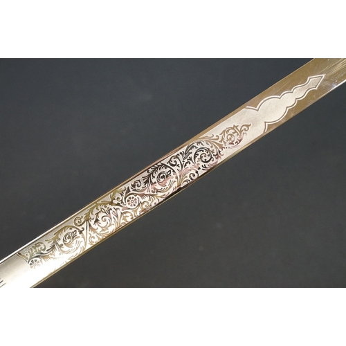 140 - A British military officers dress sword, etched blade with the QEII cypher, complete with scabbard.