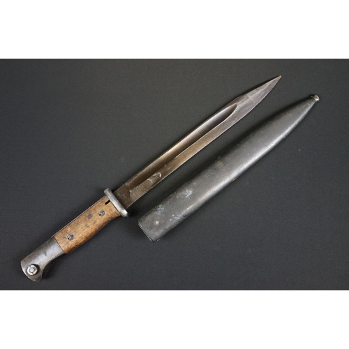 191 - A Mauser K98 Bayonet With Wooden Grip And 1944 dated scabbard
