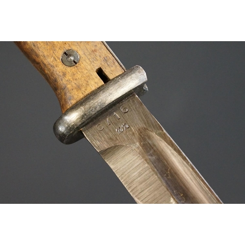 191 - A Mauser K98 Bayonet With Wooden Grip And 1944 dated scabbard