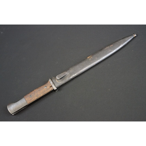 191 - A Mauser K98 Bayonet With Wooden Grip And 1944 dated scabbard
