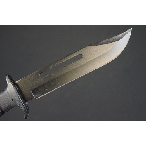 196 - A Contemporary survival knife together with leather scabbard.