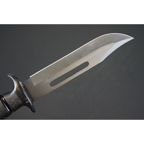 196 - A Contemporary survival knife together with leather scabbard.