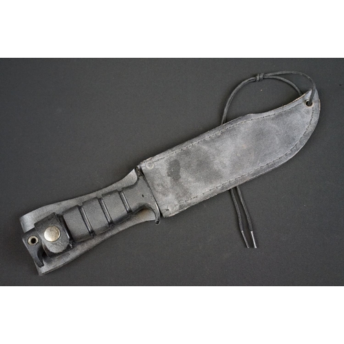 196 - A Contemporary survival knife together with leather scabbard.