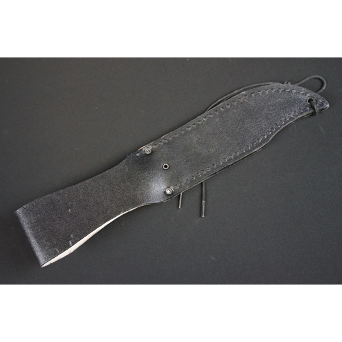 196 - A Contemporary survival knife together with leather scabbard.