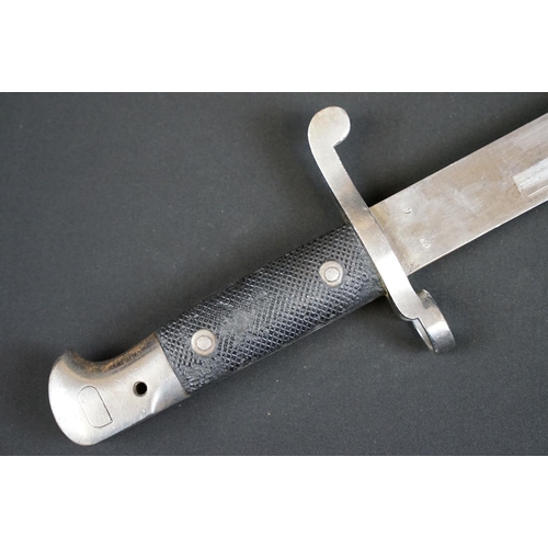 197 - A British bayonet with good clear markings to the blade complete with scabbard and white leather fro... 