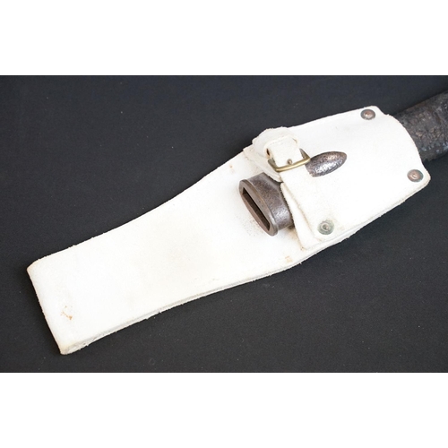 197 - A British bayonet with good clear markings to the blade complete with scabbard and white leather fro... 