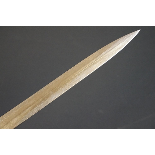 197 - A British bayonet with good clear markings to the blade complete with scabbard and white leather fro... 