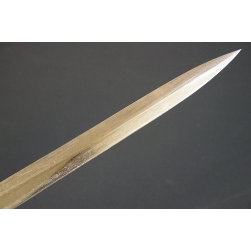 197 - A British bayonet with good clear markings to the blade complete with scabbard and white leather fro... 