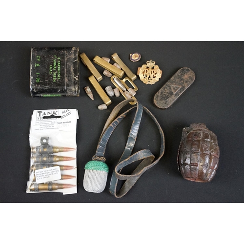 198 - A deactivated relic condition mills bomb hand grenade together with a selection of inert ammunition.