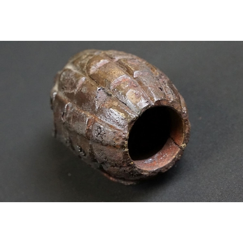 198 - A deactivated relic condition mills bomb hand grenade together with a selection of inert ammunition.