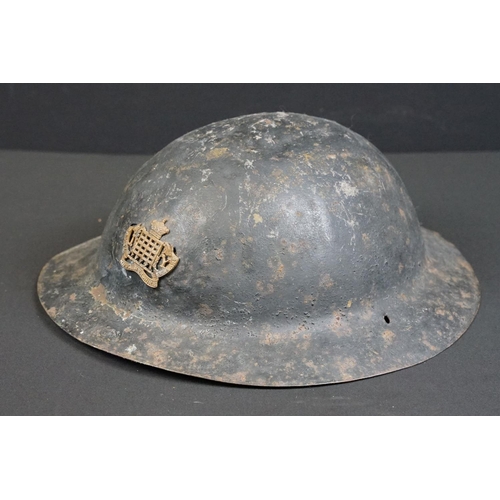 199 - A British World War One Brodie helmet badged to the Royal Gloucestershire Fusiliers.