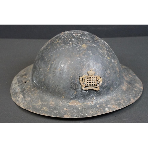 199 - A British World War One Brodie helmet badged to the Royal Gloucestershire Fusiliers.