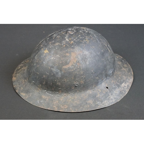 199 - A British World War One Brodie helmet badged to the Royal Gloucestershire Fusiliers.