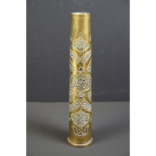 203 - A trench art vase with ornate decorative design made from a spent artillery shell.