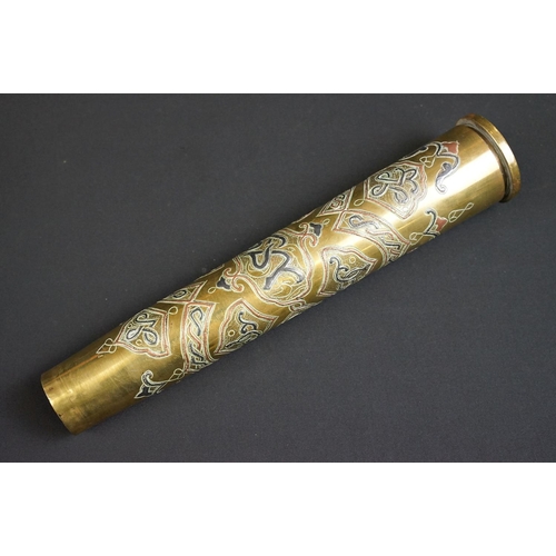 203 - A trench art vase with ornate decorative design made from a spent artillery shell.