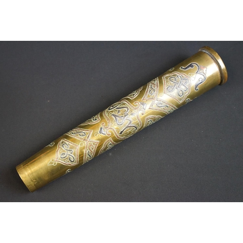 203 - A trench art vase with ornate decorative design made from a spent artillery shell.