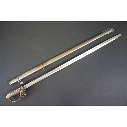 214 - A British Victorian Infantry officers sword, VRI cypher to the brass guard, complete with scabbard.