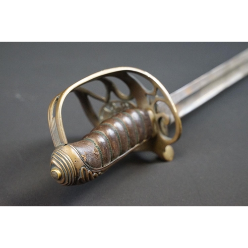 214 - A British Victorian Infantry officers sword, VRI cypher to the brass guard, complete with scabbard.