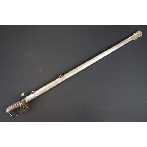 214 - A British Victorian Infantry officers sword, VRI cypher to the brass guard, complete with scabbard.