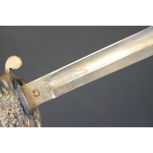 214 - A British Victorian Infantry officers sword, VRI cypher to the brass guard, complete with scabbard.