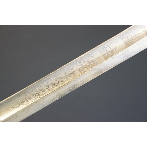 214 - A British Victorian Infantry officers sword, VRI cypher to the brass guard, complete with scabbard.