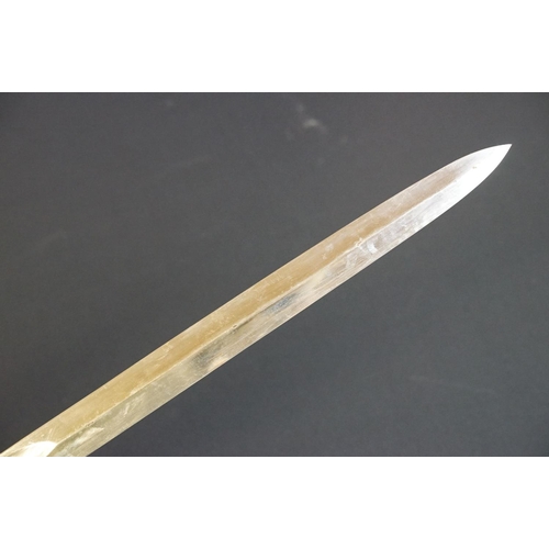 214 - A British Victorian Infantry officers sword, VRI cypher to the brass guard, complete with scabbard.