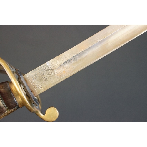 214 - A British Victorian Infantry officers sword, VRI cypher to the brass guard, complete with scabbard.