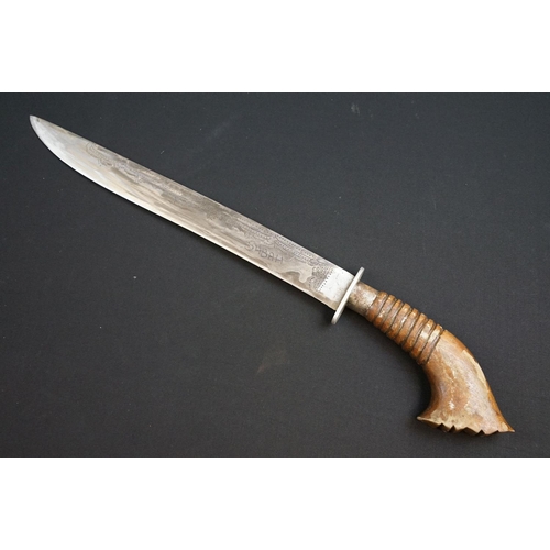 233 - A small group of knives to include a military bayonet, two Arabic daggers and a pair of mounted kukr... 