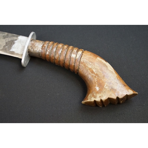 233 - A small group of knives to include a military bayonet, two Arabic daggers and a pair of mounted kukr... 