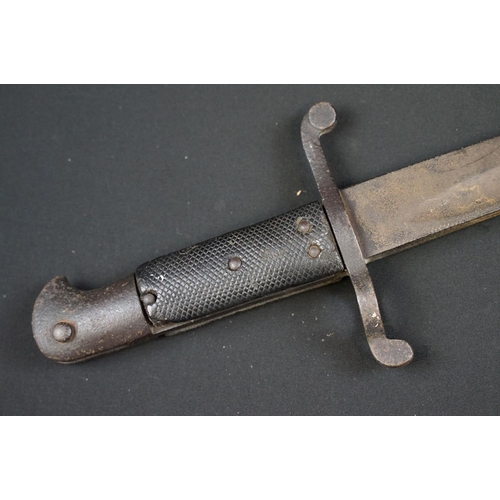 233 - A small group of knives to include a military bayonet, two Arabic daggers and a pair of mounted kukr... 