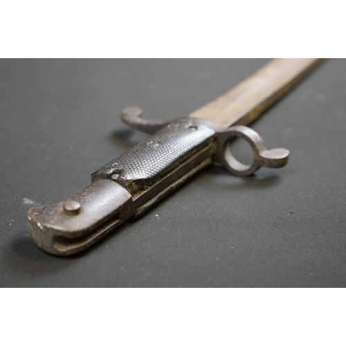 233 - A small group of knives to include a military bayonet, two Arabic daggers and a pair of mounted kukr... 