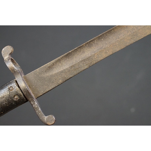 233 - A small group of knives to include a military bayonet, two Arabic daggers and a pair of mounted kukr... 