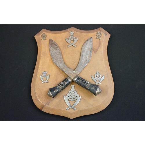 233 - A small group of knives to include a military bayonet, two Arabic daggers and a pair of mounted kukr... 