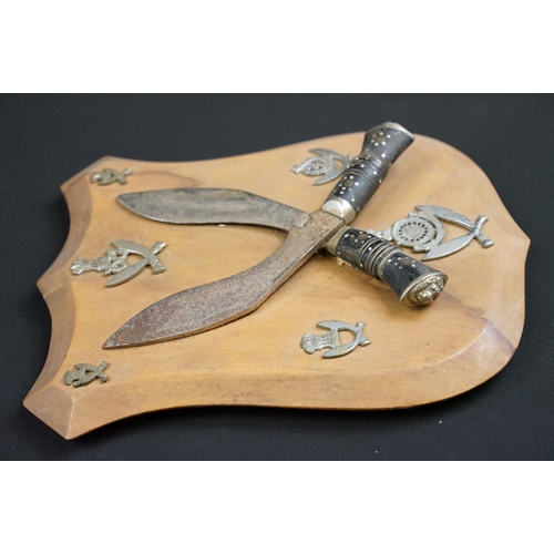 233 - A small group of knives to include a military bayonet, two Arabic daggers and a pair of mounted kukr... 