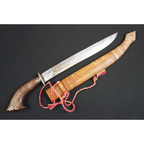 233 - A small group of knives to include a military bayonet, two Arabic daggers and a pair of mounted kukr... 