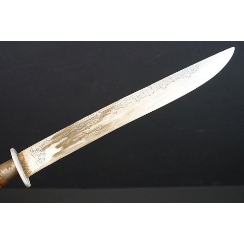 233 - A small group of knives to include a military bayonet, two Arabic daggers and a pair of mounted kukr... 