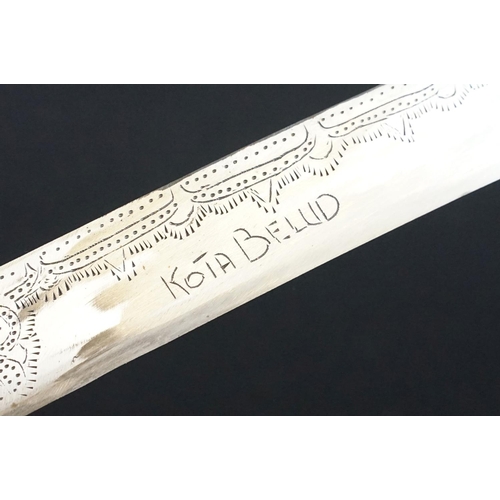 233 - A small group of knives to include a military bayonet, two Arabic daggers and a pair of mounted kukr... 