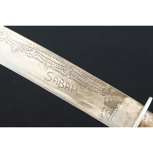 233 - A small group of knives to include a military bayonet, two Arabic daggers and a pair of mounted kukr... 