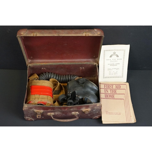 30 - A Vintage World War Two British issued respirator together with associated Civil Defence paperwork.