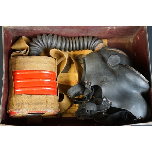 30 - A Vintage World War Two British issued respirator together with associated Civil Defence paperwork.