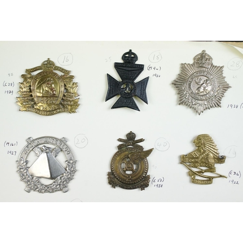 82 - A collection of mainly Canadian military cap badges to include The Lake Superior Regiment, The Halif... 