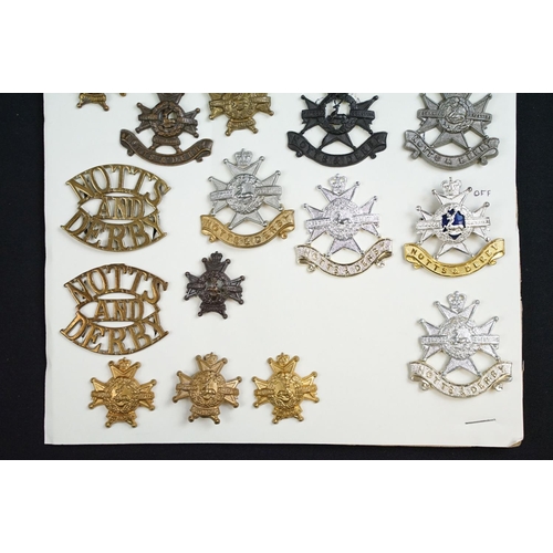 84 - A collection of Notts and Derby Regiment cap and collar badges to include KC, QC and QVC examples, i... 