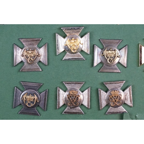 85 - A collection of The Wiltshire Regiment cap and collar badges.