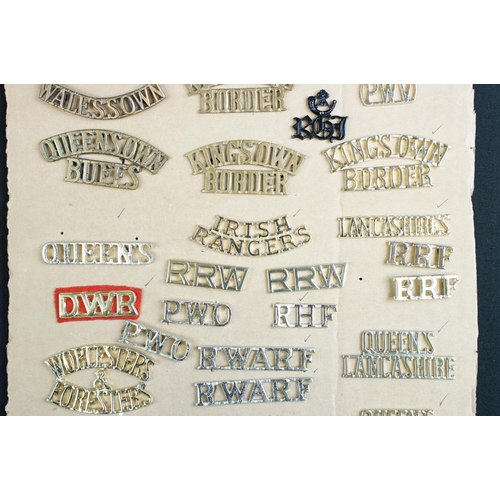 89 - A collection of British military regimental collar / shoulder titles.