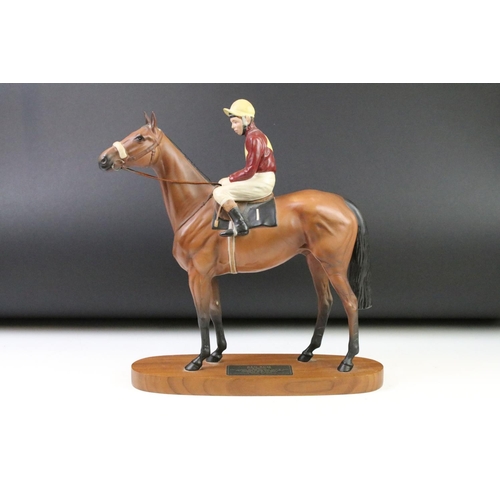 11 - Beswick 'Red Rum' connoisseur model racehorse & jockey, raised on an oblong wooden base, approx 33cm... 