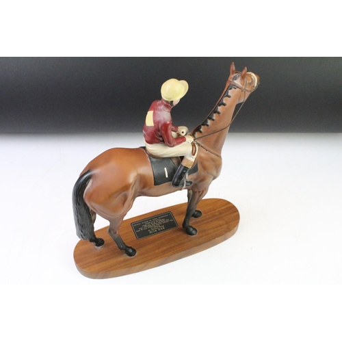 11 - Beswick 'Red Rum' connoisseur model racehorse & jockey, raised on an oblong wooden base, approx 33cm... 