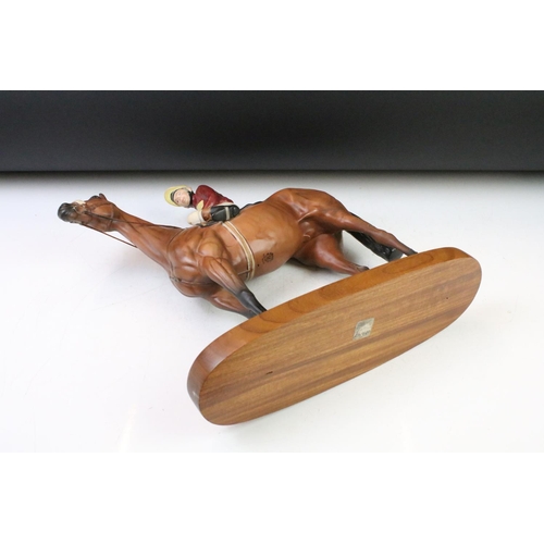 11 - Beswick 'Red Rum' connoisseur model racehorse & jockey, raised on an oblong wooden base, approx 33cm... 